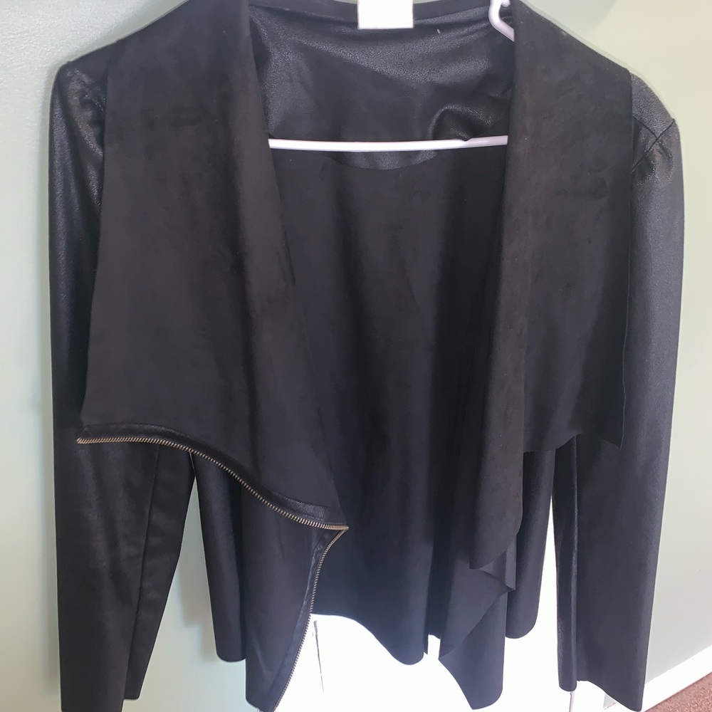 Women’s faux leather and suade jacket. Side zipper. Never warn. Size small.